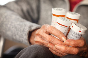 Elderly holding medicines