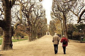 Two elderly people walking